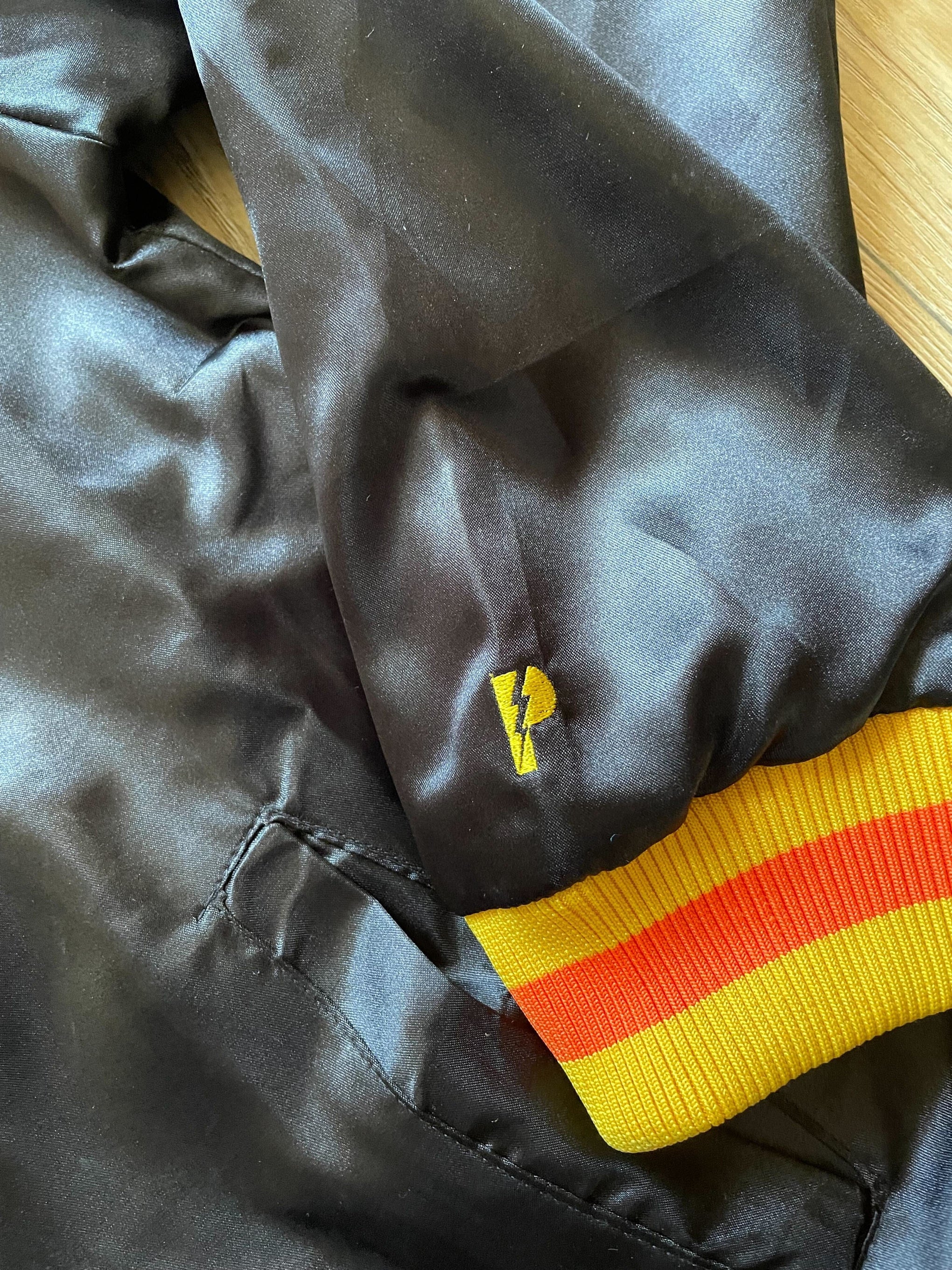 Black Satin Baseball Jacket with Yellow Pockets and Knit Lines